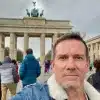 The artist Oddtoe in Berlin, Germany, in front of the Brandenburg Gate.